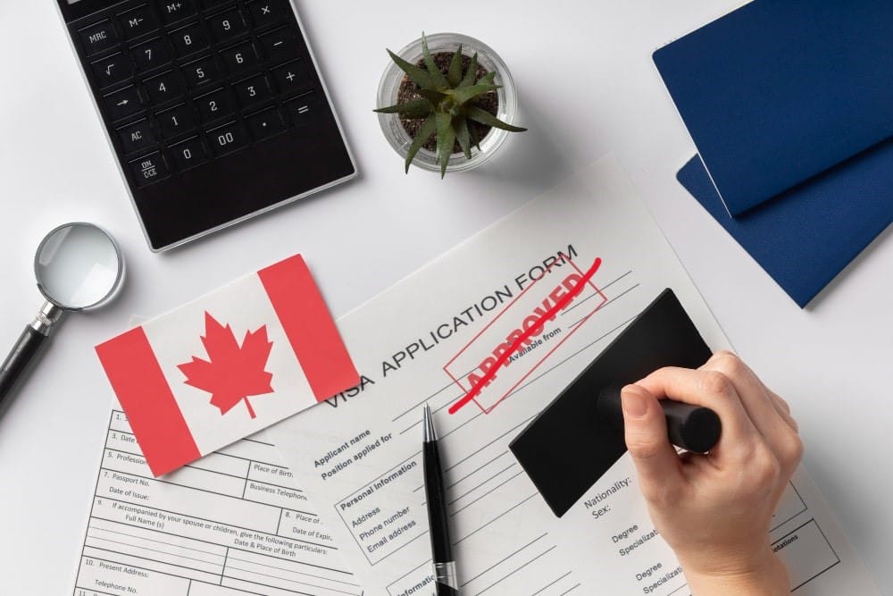 Canada visa application form with 'Approved' crossed out, symbolizing a rejected application.