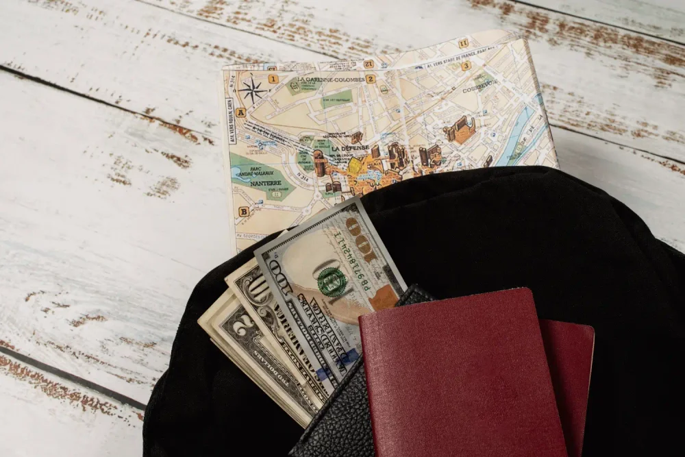 Passport and cash with travel map symbolizing fraud in immigration services charging fees without providing services