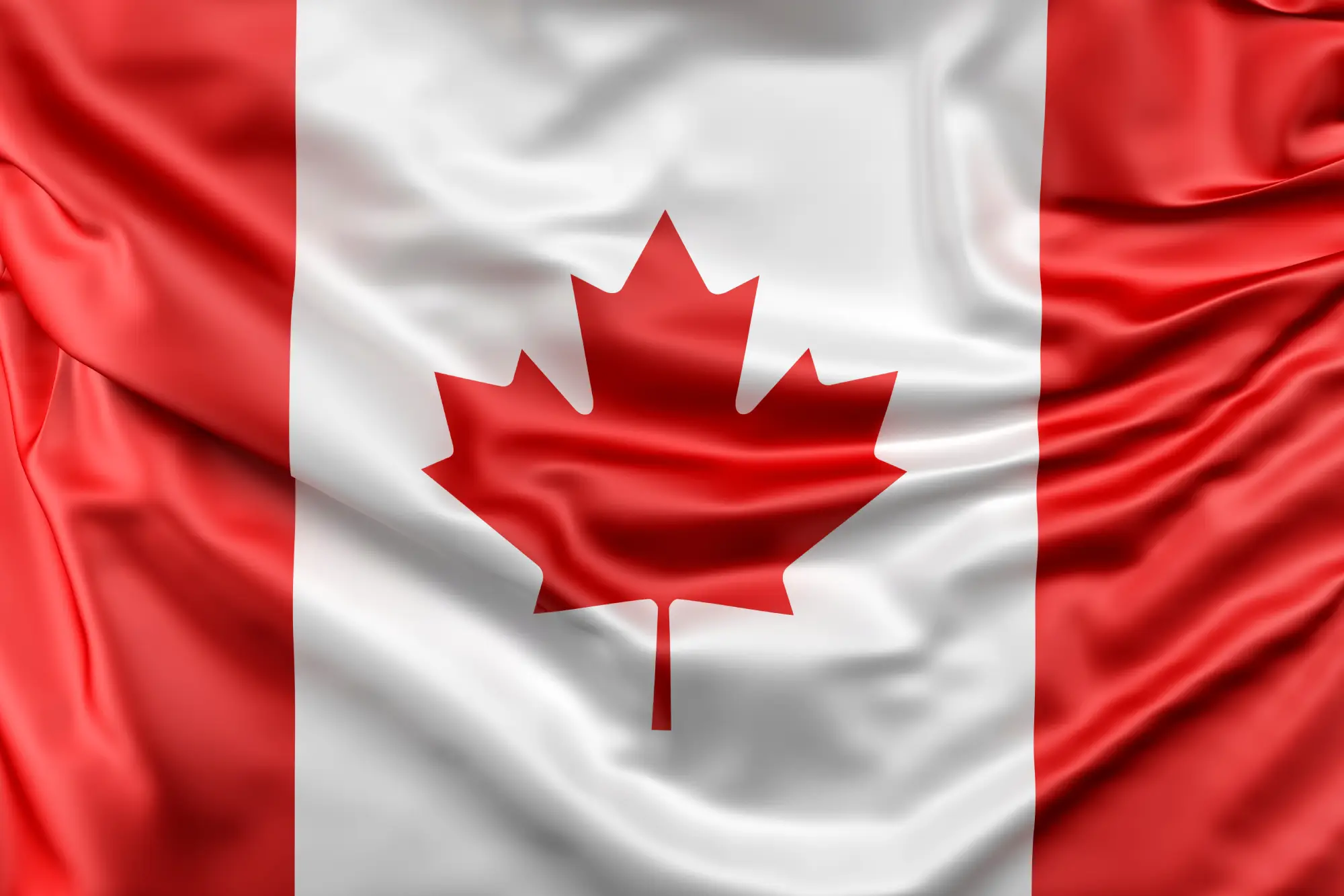 Close-up of Canadian flag, representing Ontario’s invitation to Express Entry candidates for provincial nomination